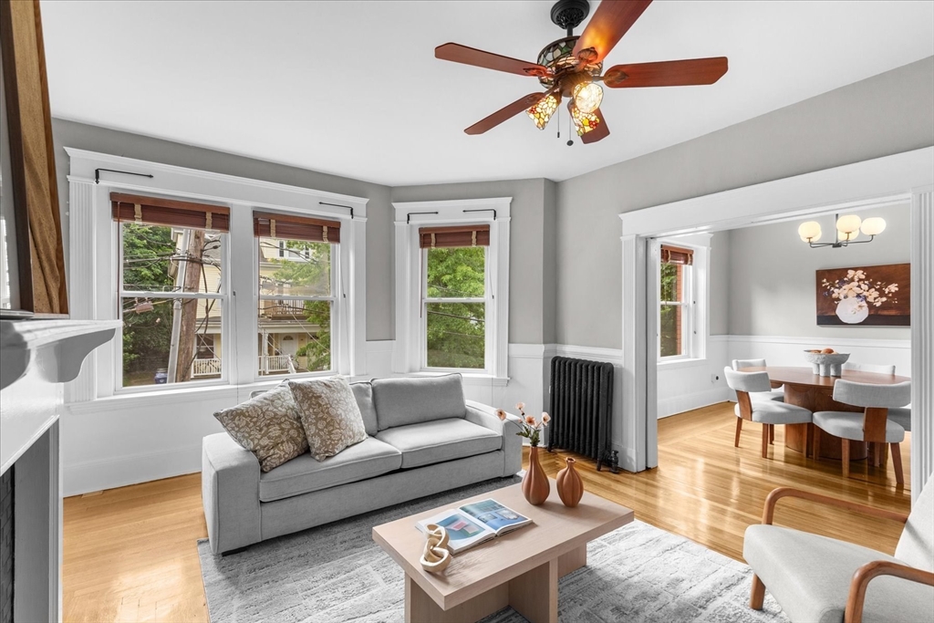 9 Verndale Street, Unit 2 Brookline, MA 02446 - Photo 7 of 39 a living room with furniture and a large window