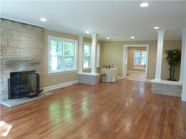 404 Golfview Lane Springfield, TN 37172 - Photo 2 of 20 Living room features brick fireplace, hardwood floor and beautiful columns
