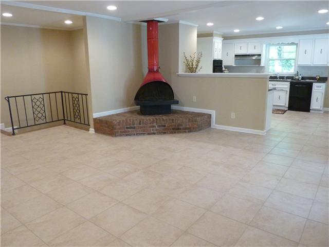 404 Golfview Lane Springfield, TN 37172 - Photo 3 of 20 Family room features tile floor and beautiful stove - perfect setting for family gathering
