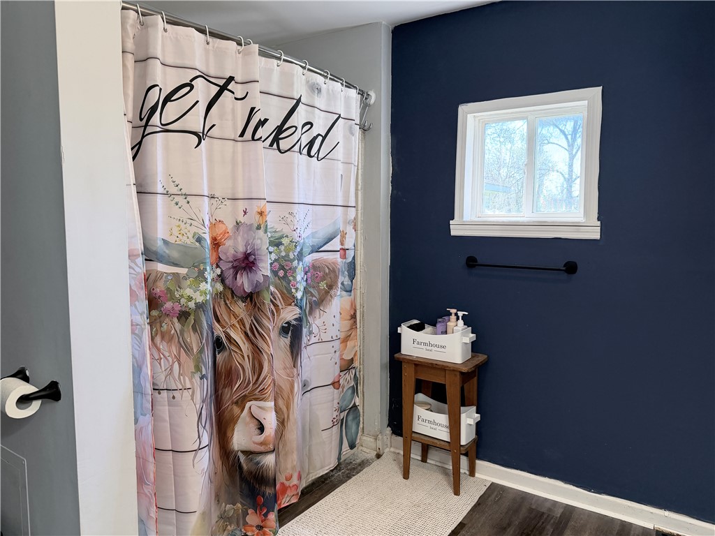 6800 Farmington Road Miamisburg, OH 45342 - Photo 17 of 32 This bathroom features durable flooring and a window for natural light.