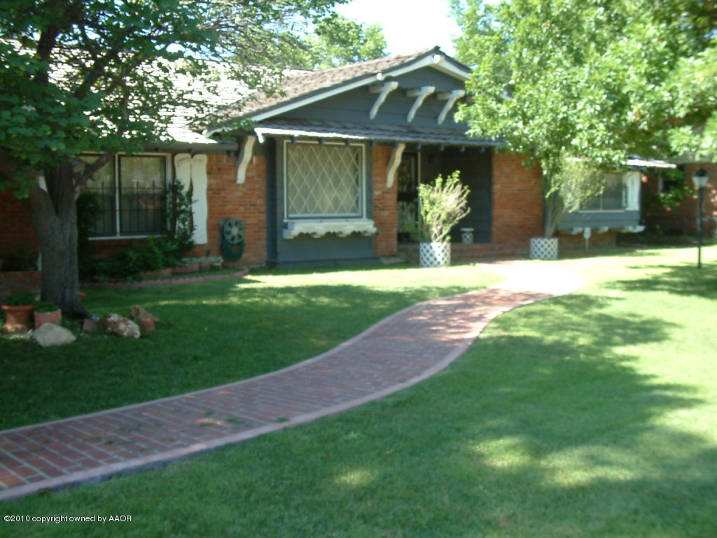 6303 Elmhurst Road Amarillo, TX 79106 - Photo 2 of 2 a front view of a house with garden