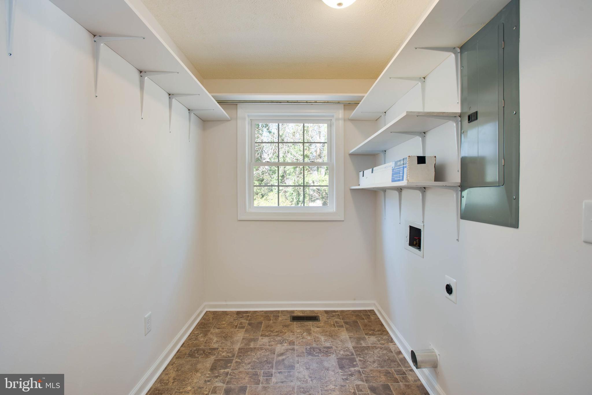 15690 Oakland Road Reva, VA 22735 - Photo 28 of 74 laundry room/ mud room with shelving for storage