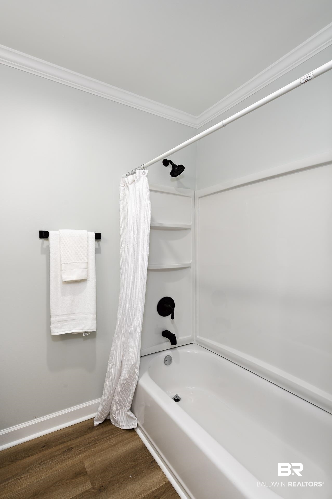 6001 Camp Halls Mill Road Mobile, AL 36619 - Photo 27 of 52 Bathroom featuring shower / tub combo with curtain, dark wood-style floors, and ornamental molding