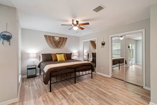 a bedroom with bed and window