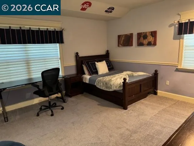 a bedroom with a bed and furniture