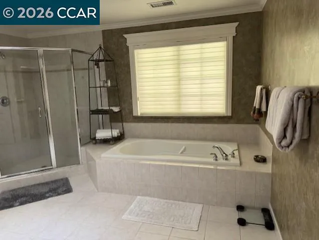 a bath tub sitting next to a window