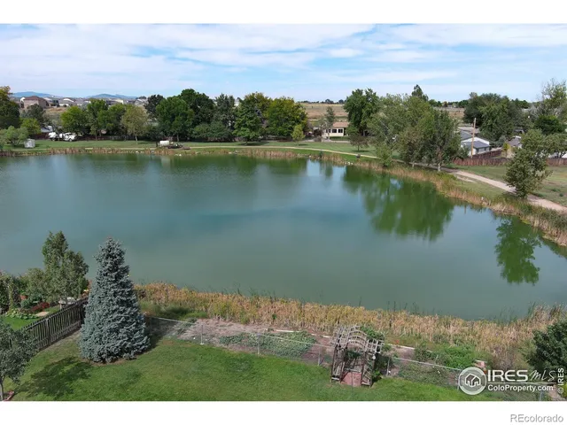 an aerial view of a houses with ocean view