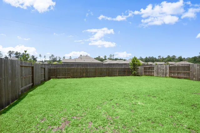 a view of a backyard with green space