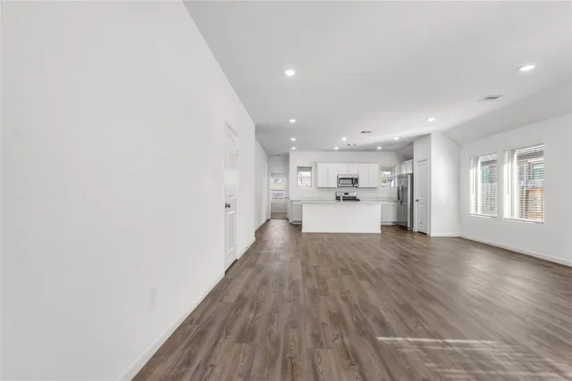 a view of kitchen with wooden floor