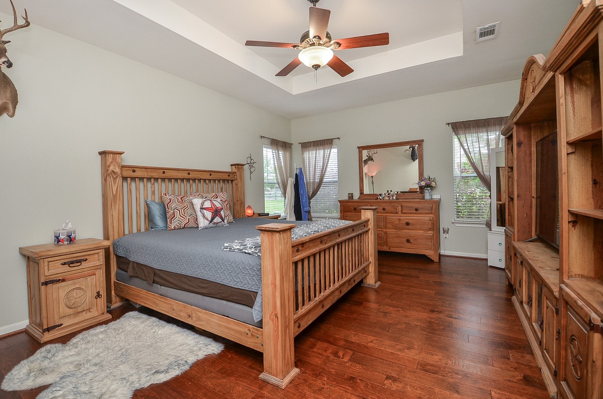 27644 Spring Hill Road Hempstead, TX 77445 - Photo 22 of 50 What a marvelous place for peace and repose! This primary suite invites super-sized pieces with amazing floor and wall space and bright, natural light. Note the tray ceiling theme, here too.