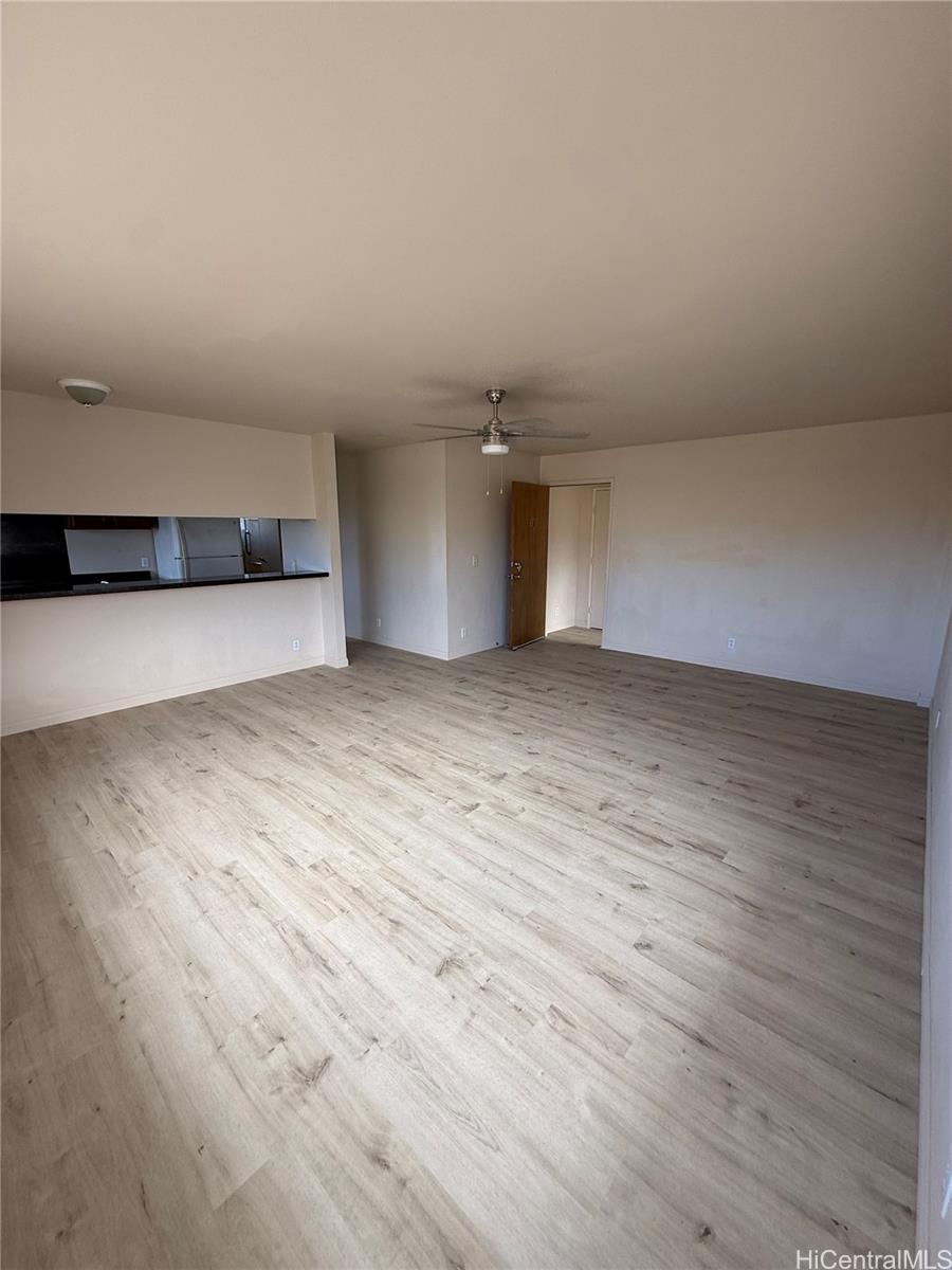 85-808 Lihue Street, Unit UPPR Waianae, HI 96792 - Photo 4 of 19 an empty room with wooden floor