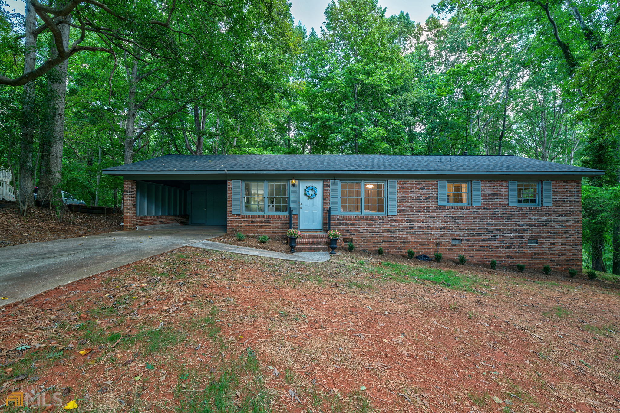 310 Cavalier Road Athens, GA 30606 - Photo 1 of 1 a view of a house with backyard and sitting area