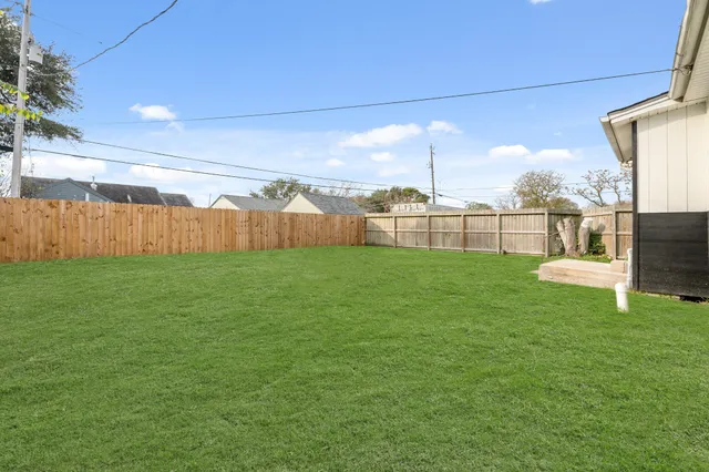 a view of a backyard with garden