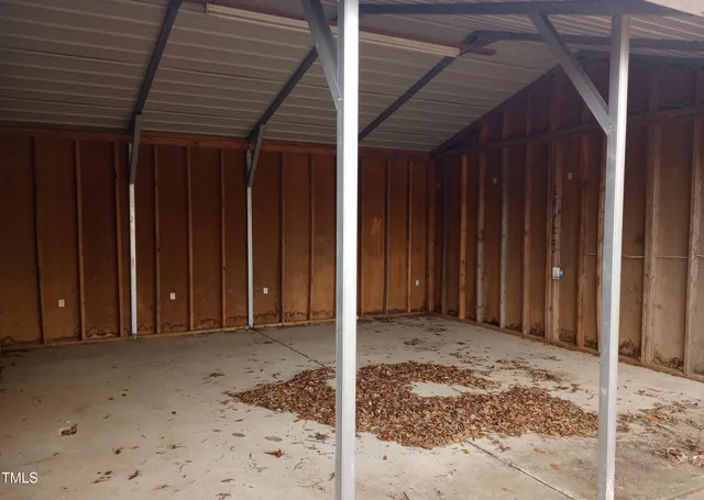a kitchen with a sink a refrigerator and cabinets
