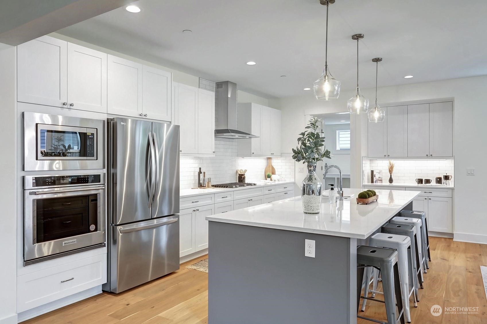 7922 203rd Street Southwest Edmonds, WA 98026 - Photo 11 of 33 a kitchen with stainless steel appliances granite countertop a sink refrigerator and cabinets