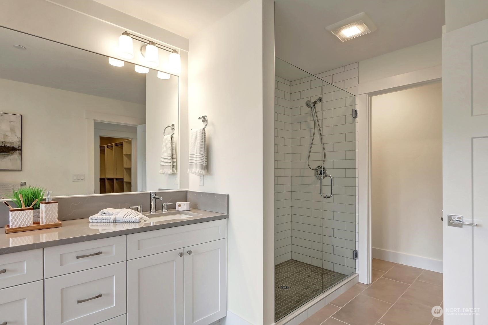 7922 203rd Street Southwest Edmonds, WA 98026 - Photo 20 of 33 a bathroom with a granite countertop sink mirror and shower