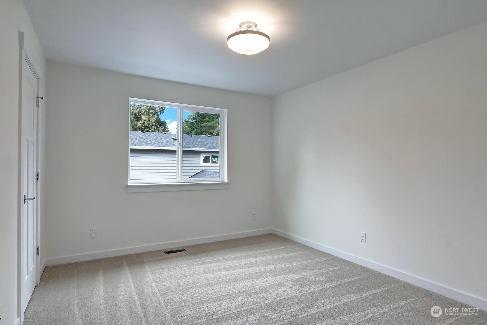 7922 203rd Street Southwest Edmonds, WA 98026 - Photo 22 of 33 an empty room with a window