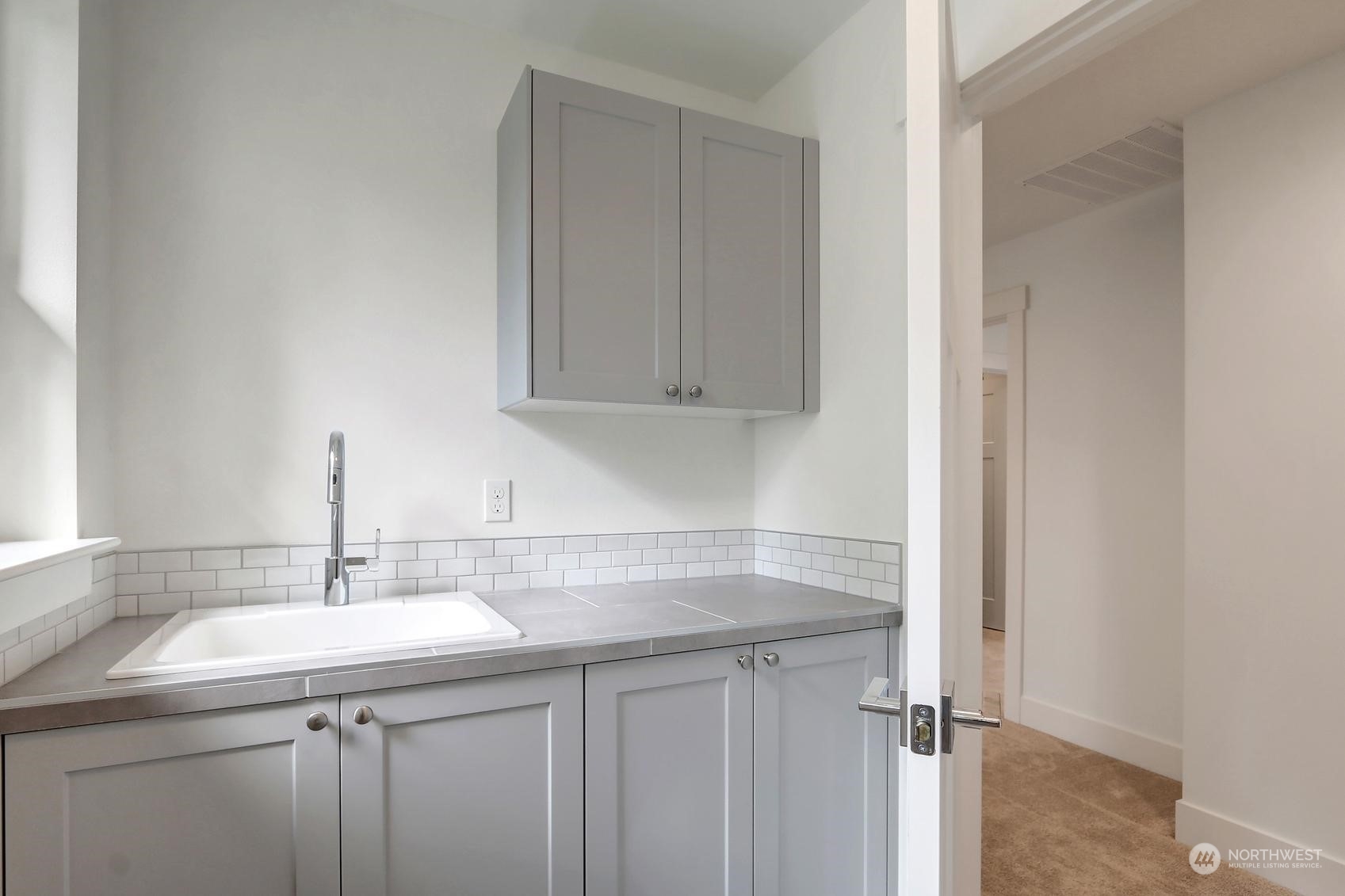 7922 203rd Street Southwest Edmonds, WA 98026 - Photo 24 of 33 a bathroom with a sink and a mirror