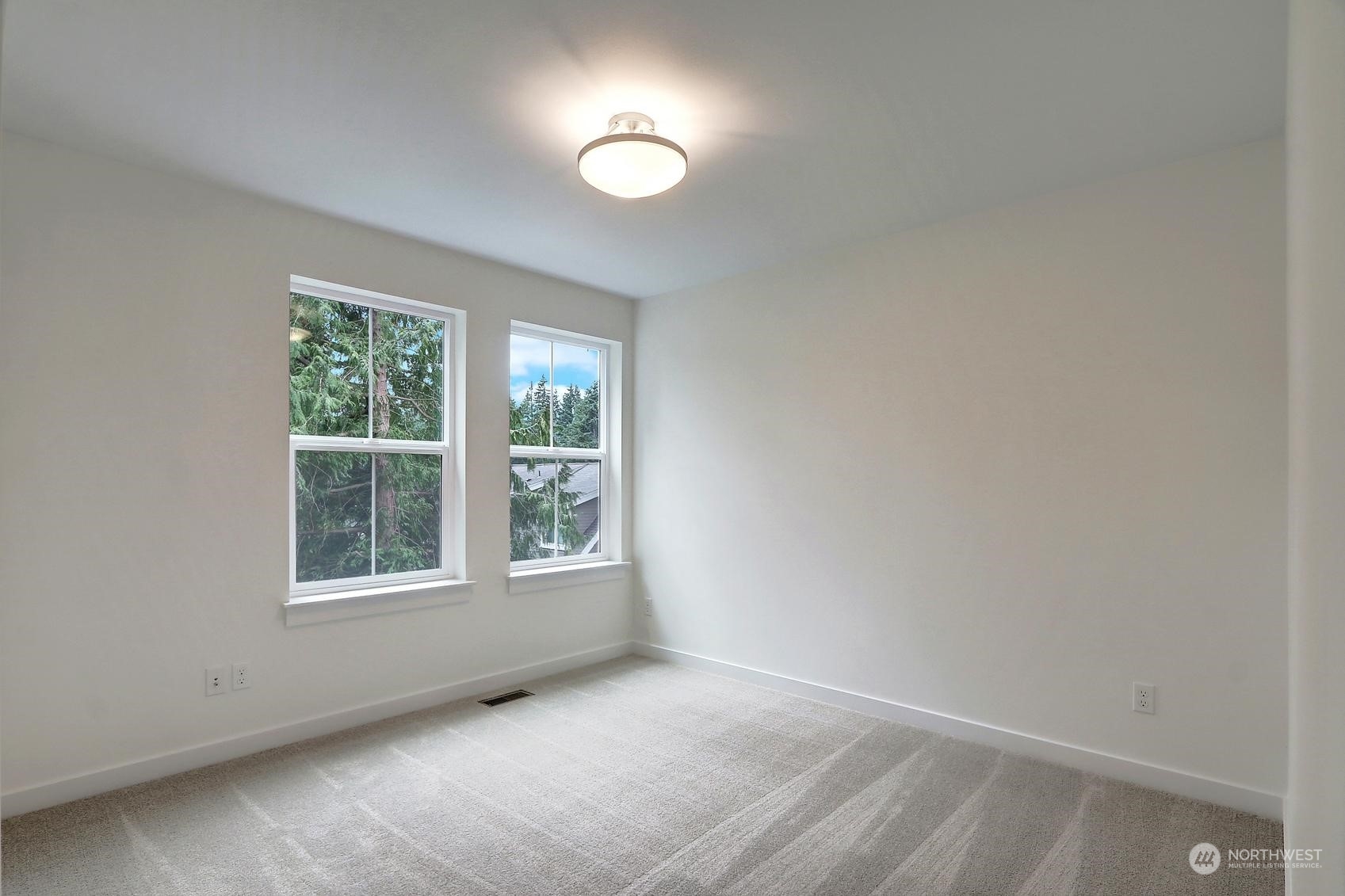 7922 203rd Street Southwest Edmonds, WA 98026 - Photo 26 of 33 an empty room with windows and closet