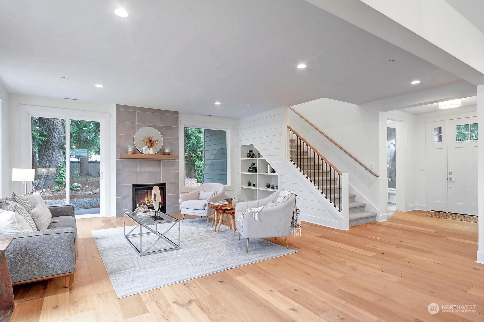 7922 203rd Street Southwest Edmonds, WA 98026 - Photo 3 of 33 a living room with furniture and a fireplace