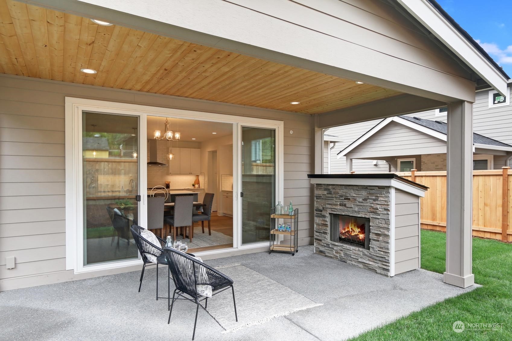 7922 203rd Street Southwest Edmonds, WA 98026 - Photo 6 of 33 a patio with a table and chairs and potted plants