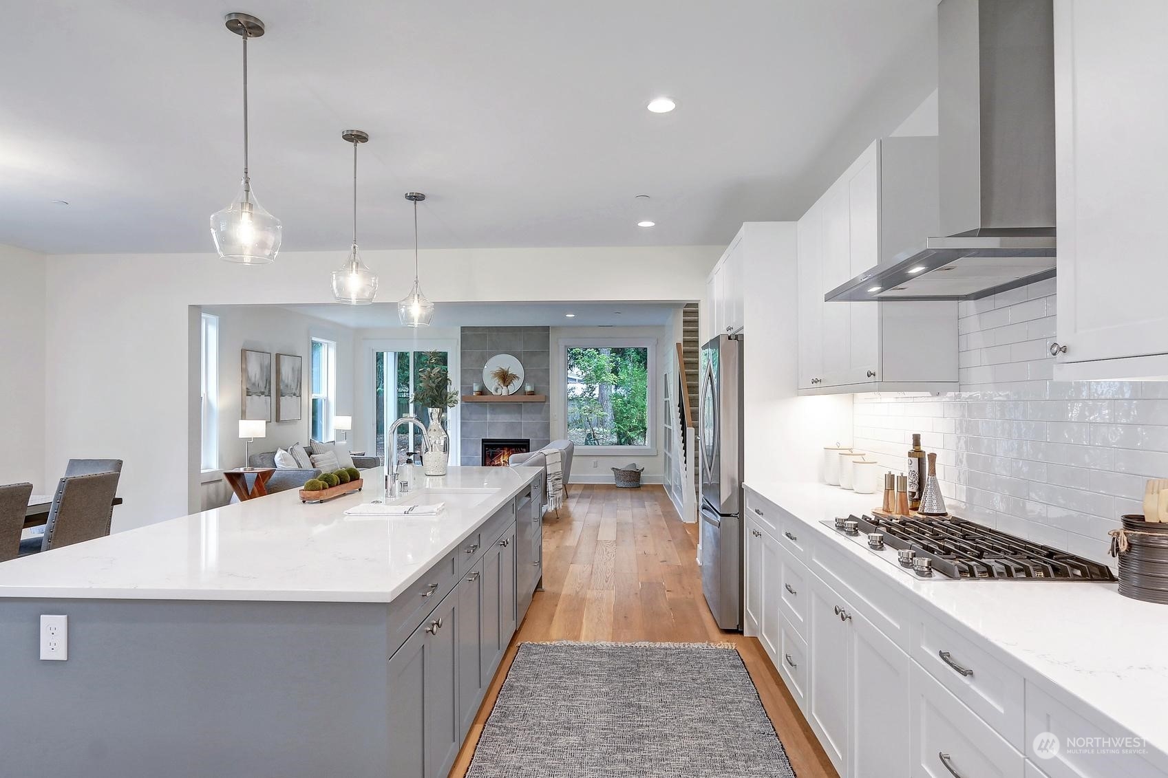 7922 203rd Street Southwest Edmonds, WA 98026 - Photo 10 of 33 a large kitchen with kitchen island a large counter space a sink appliances and cabinets