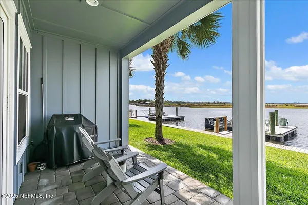 a view of a back yard from a balcony