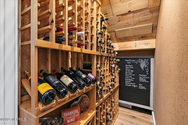 a living room with furniture wooden floor and a flat screen tv