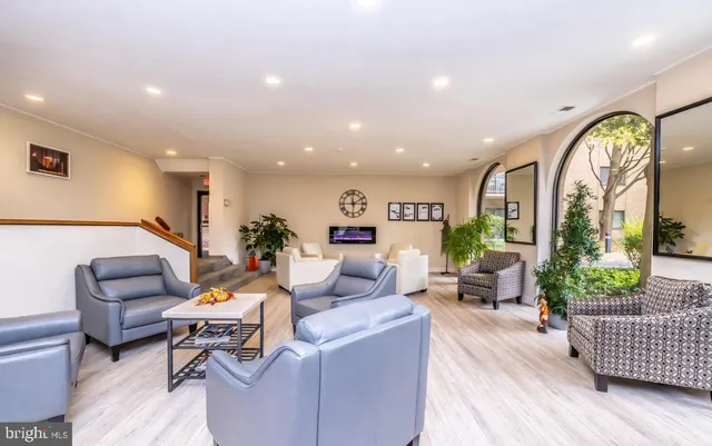 a living room with furniture and a large window