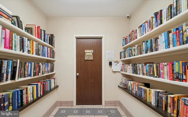 a living room with lots of books