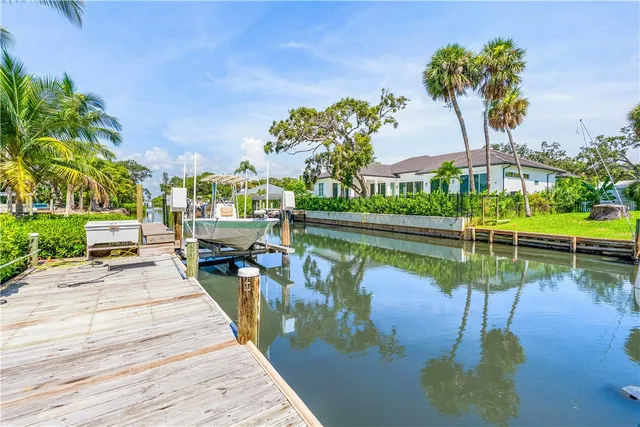 a view of a lake with a house in the background