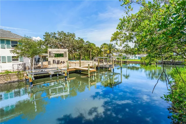 a view of an ocean house with outdoor seating