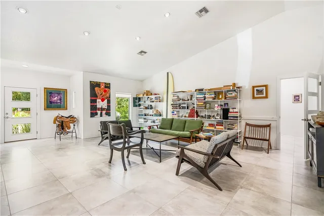 a living room with furniture and a rug
