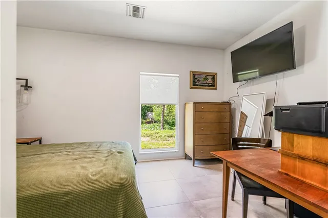 a workspace with furniture and flat screen tv