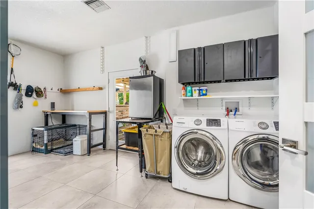 a view of kitchen sink and cabinets