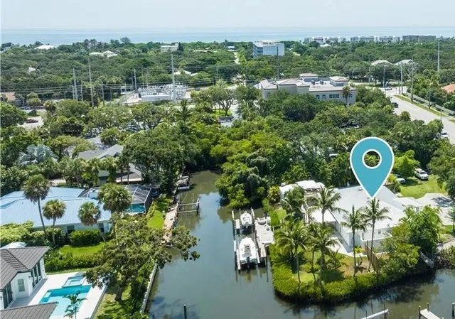 an aerial view of a house with a yard