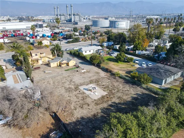 an aerial view of houses with outdoor space
