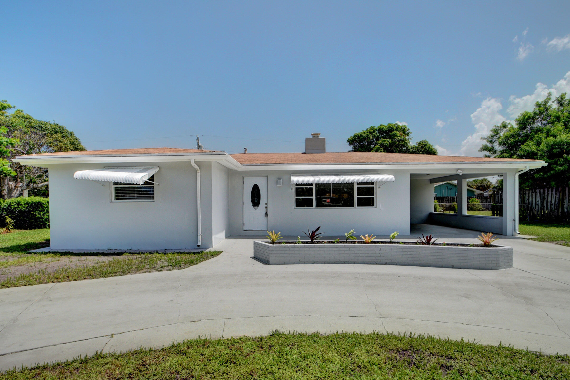 1064 Wilkinson Road Lantana, FL 33462 - Photo 1 of 36 Front