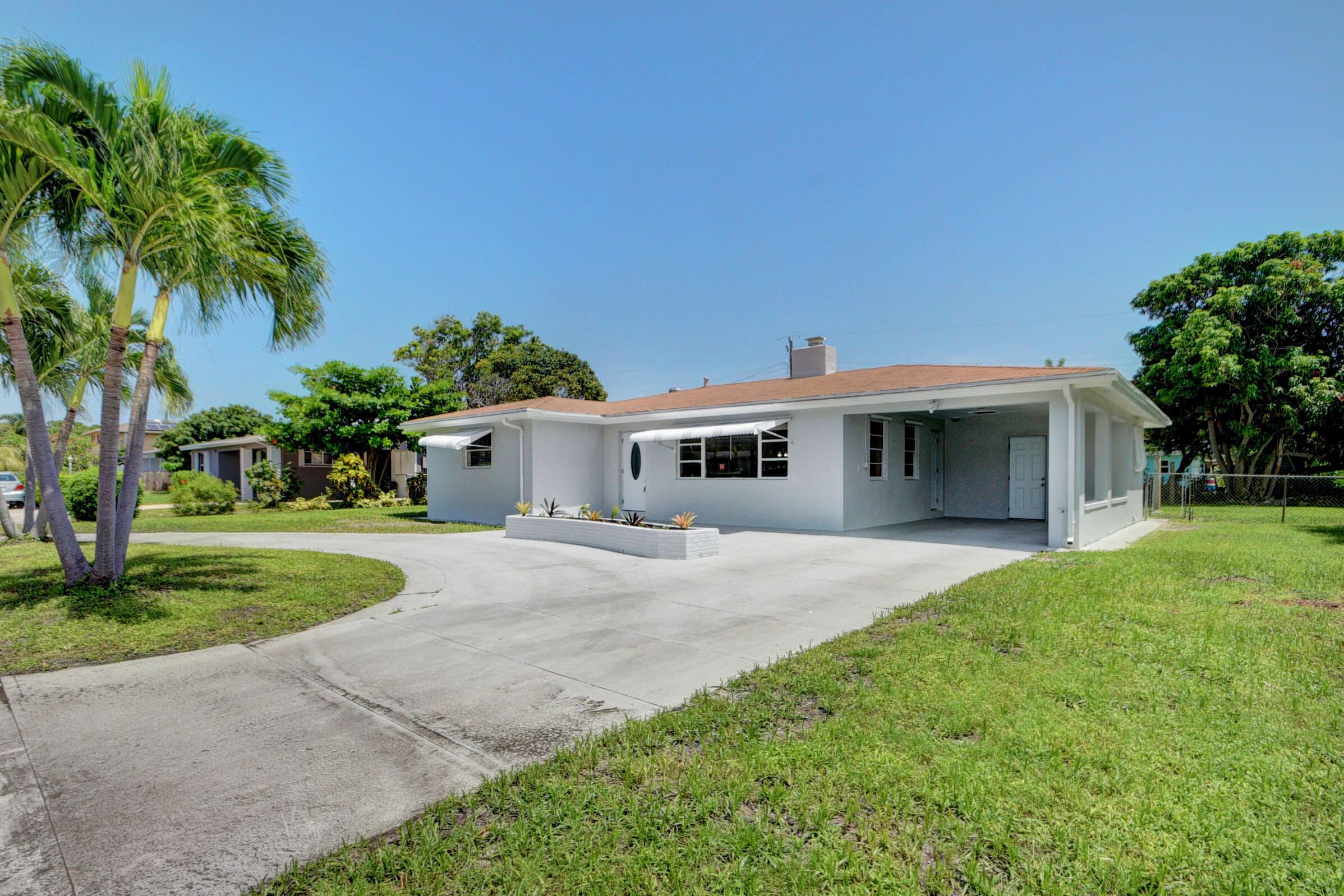 1064 Wilkinson Road Lantana, FL 33462 - Photo 2 of 36 Front 2