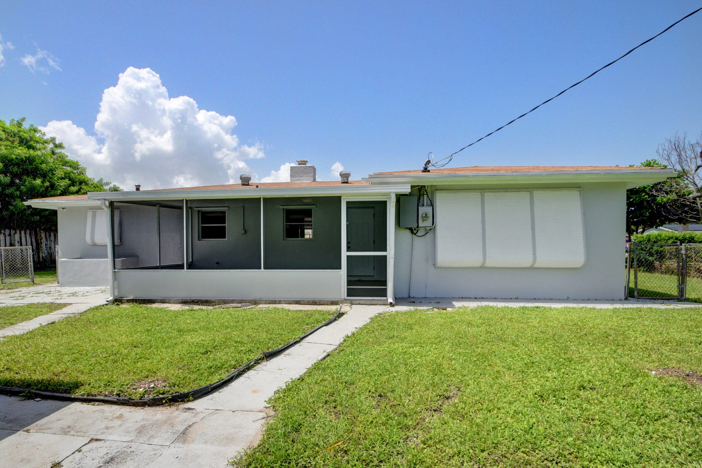 1064 Wilkinson Road Lantana, FL 33462 - Photo 23 of 36 rear
