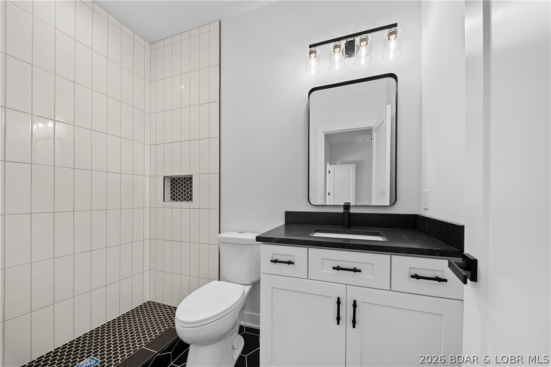 222 Red Bud Road Lake Ozark, MO 65049 - Photo 45 of 64 Stylish guest bathroom featuring modern fixtures a