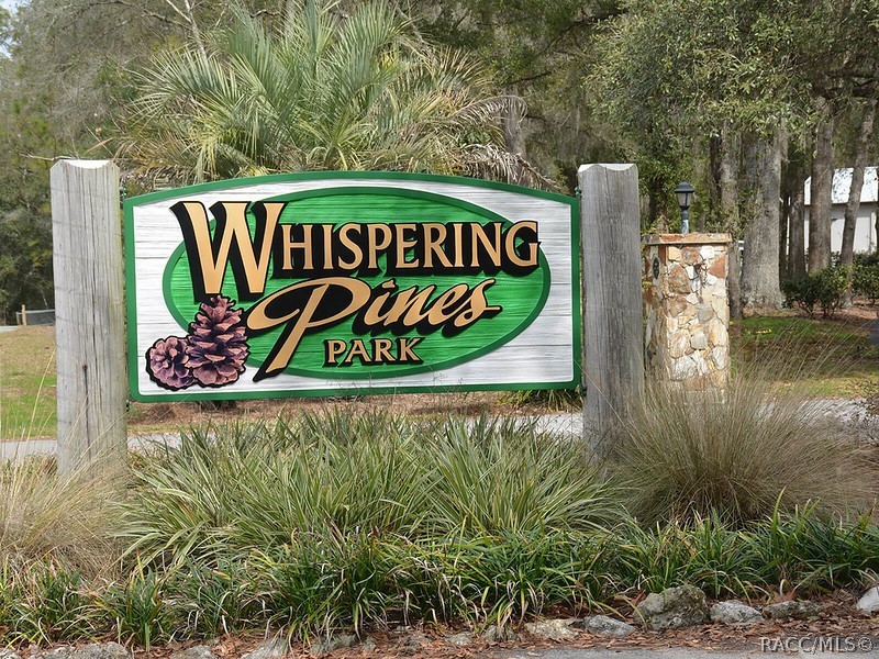 1140 South Highlands Avenue Inverness, FL 34452 - Photo 48 of 54 a sign on the side of a building
