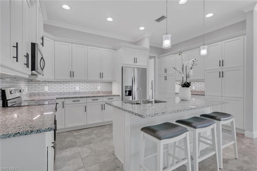 6933 Saona Court Naples, FL 34113 - Photo 9 of 44