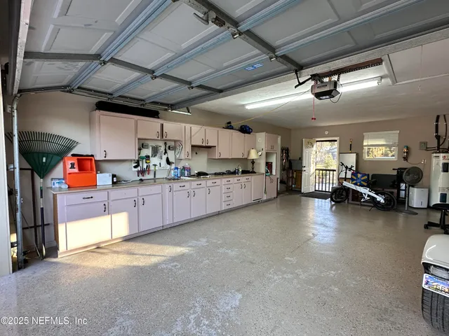 a kitchen with stainless steel appliances kitchen island granite countertop lots of counter top space
