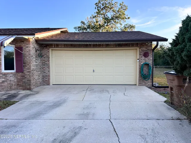 a front view of a house with a garage