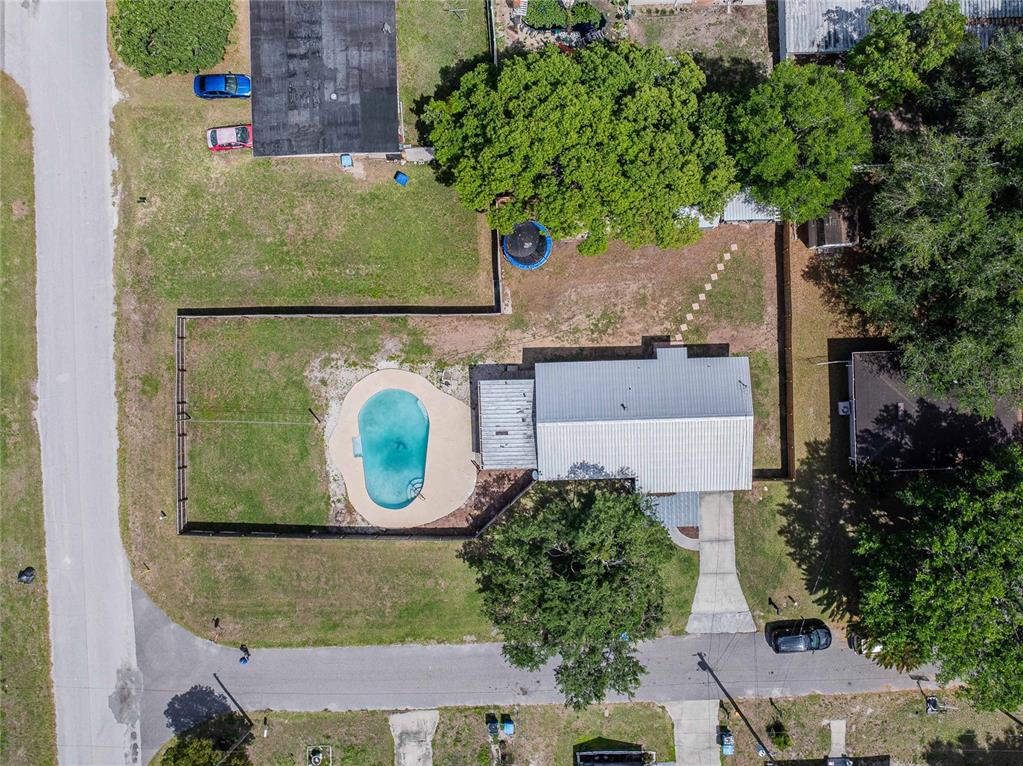 218 North Maple Lane Fort Meade, FL 33841 - Photo 4 of 37 an aerial view of a house with a yard swimming pool and outdoor seating