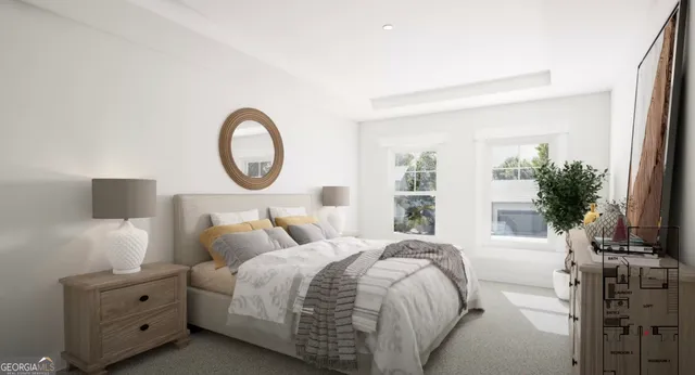 a bedroom with bed and a large window