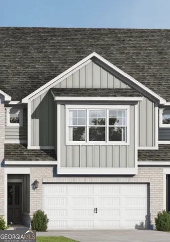 a view of a house with large windows