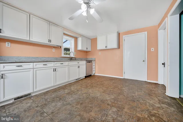 a view of a kitchen with electric appliances