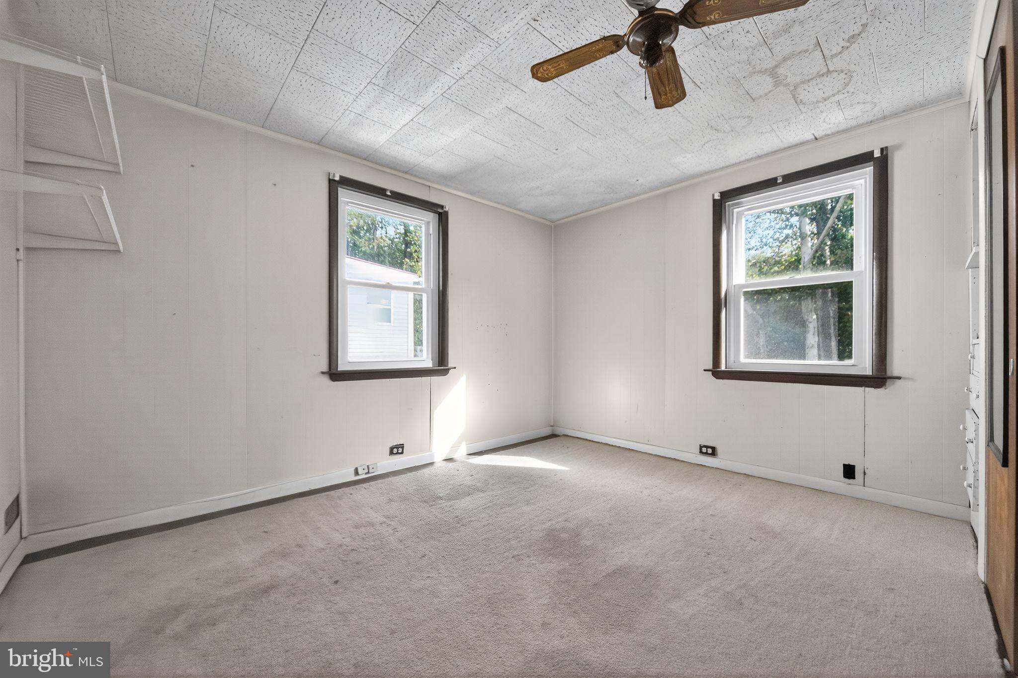 1196 Rebel Hill Road Conshohocken, PA 19428 - Photo 10 of 28 an empty room with windows and cabinet
